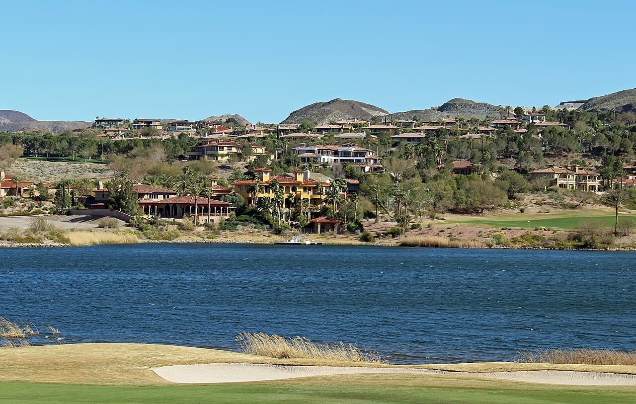 Lake Las Vegas water, golf-course foreground and hillside residences near Rue Mediterra on the South Shore.