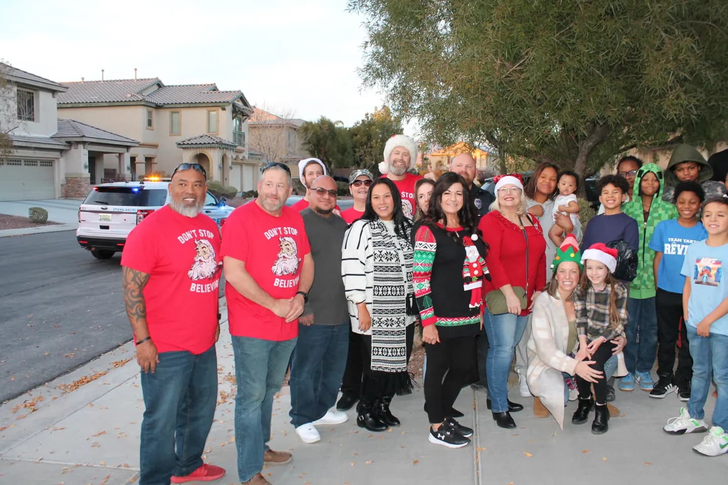 Sgt. Santa participants gather outdoors in festive clothing.