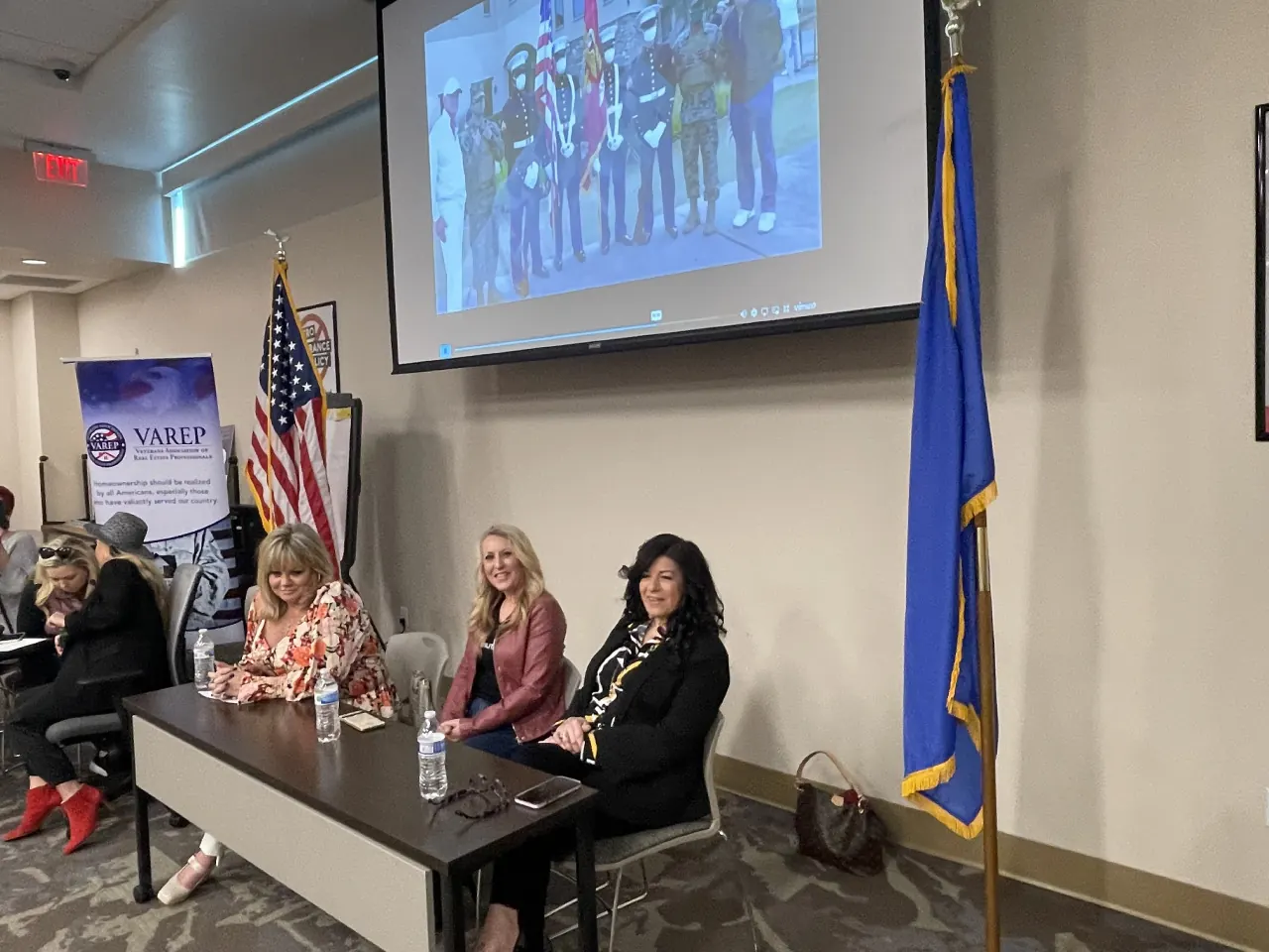 Panelists sit at a table during the Women in Real Estate event.